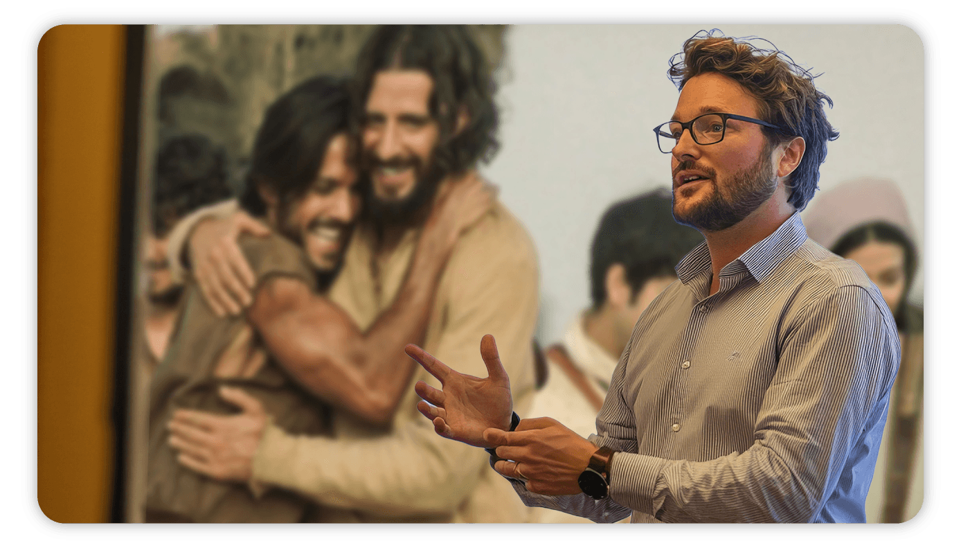 A pastor teaching during a service, with a movie scene projected on the wall behind him